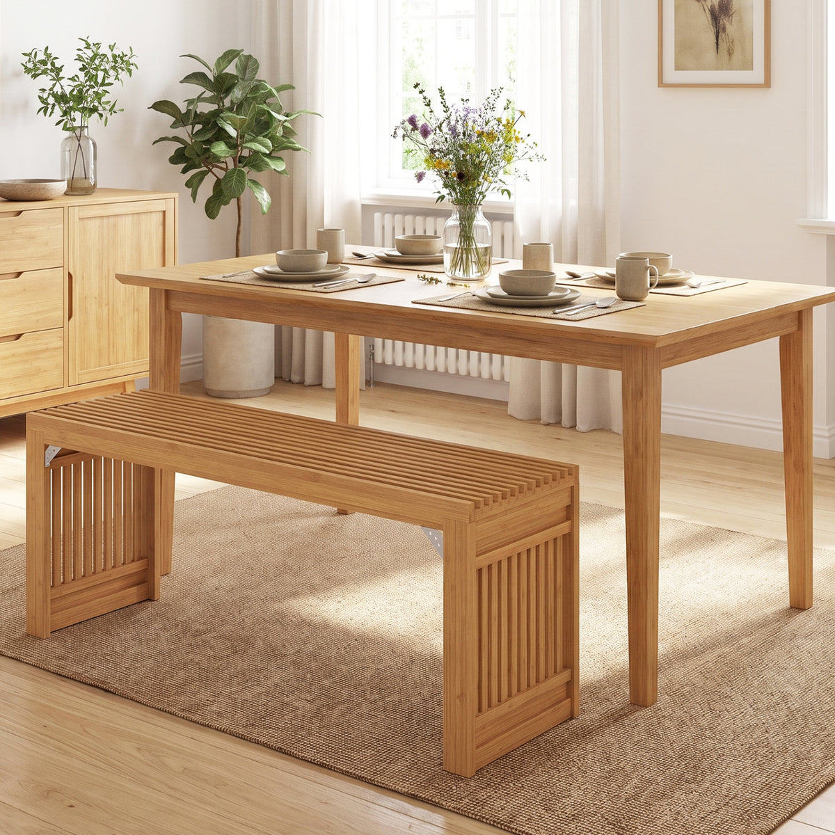 Slatted bamboo bench positioned at a dining table on a woven rug.