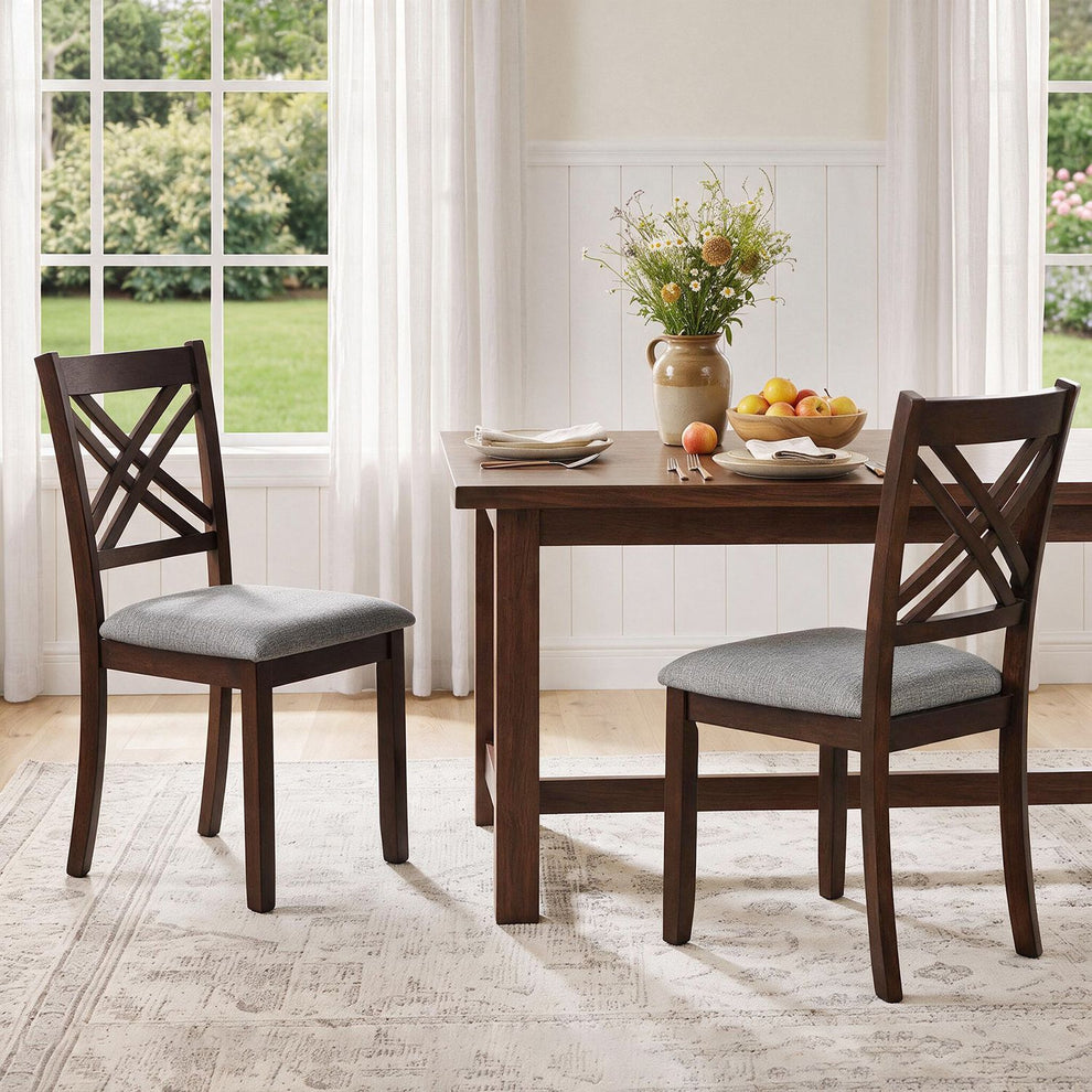 Brown crossed-slat dining chairs with gray seats beside a dining table