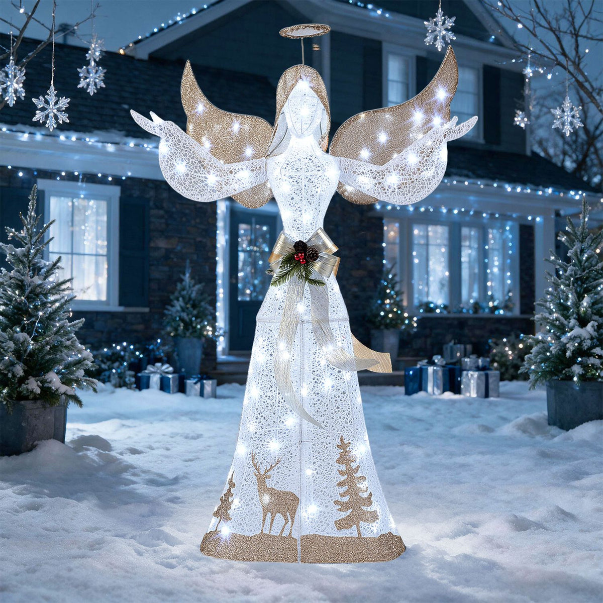 Glittered angel with outstretched wings glowing in a snowy yard beneath hanging snowflake decorations.