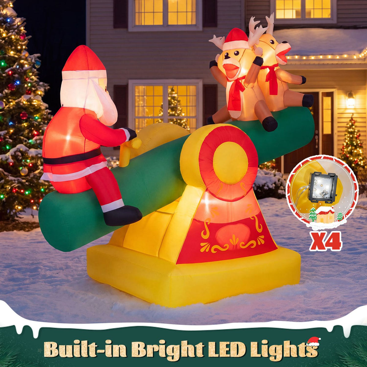 Glowing inflatable Santa and two reindeer on a teeter-totter in a snowy yard at night.