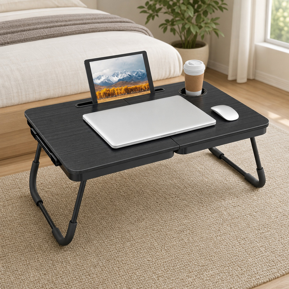 Foldable Lap Desk Bed Table 23.4" with Cup Holder & Tablet Slot — Black, Charcoal, centered in a warm neutral furnished room