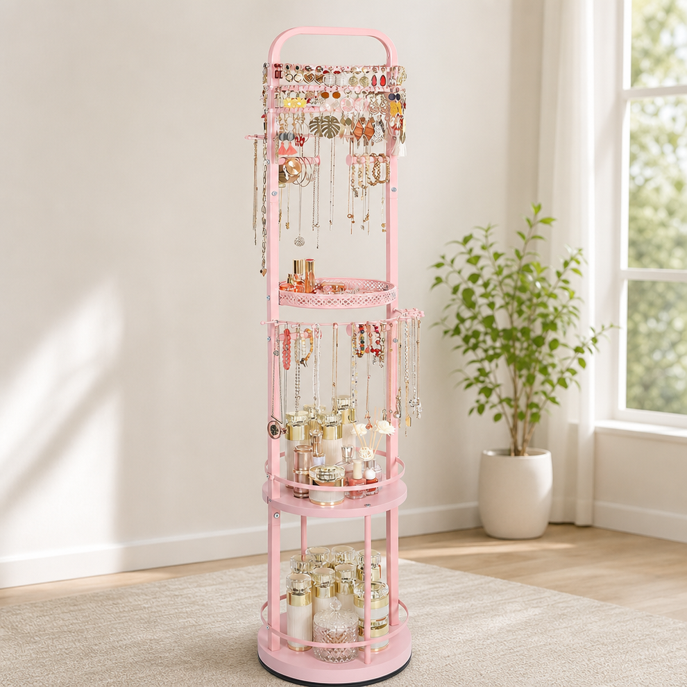 Pink rotating floor jewelry organizer full front view with jewelry and three shelves in a bright room