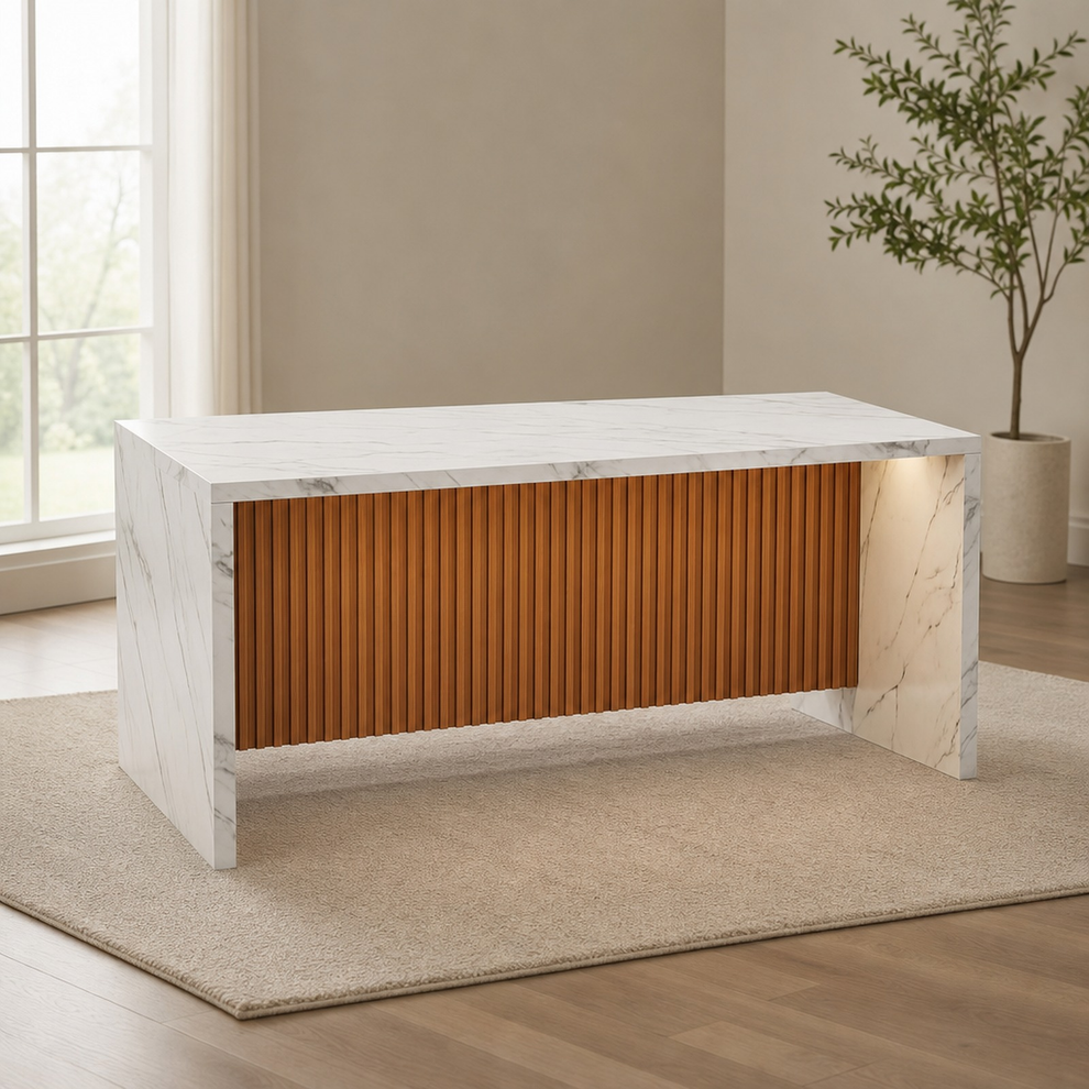 White faux-marble island table with brown fluted front, shown alone in a bright room.