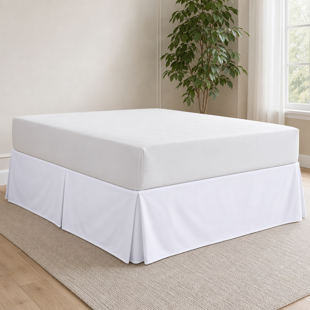 Pleated Bed Skirt — Hides Under-Bed Storage, Multiple Sizes & Colors centered in a warm neutral furnished room