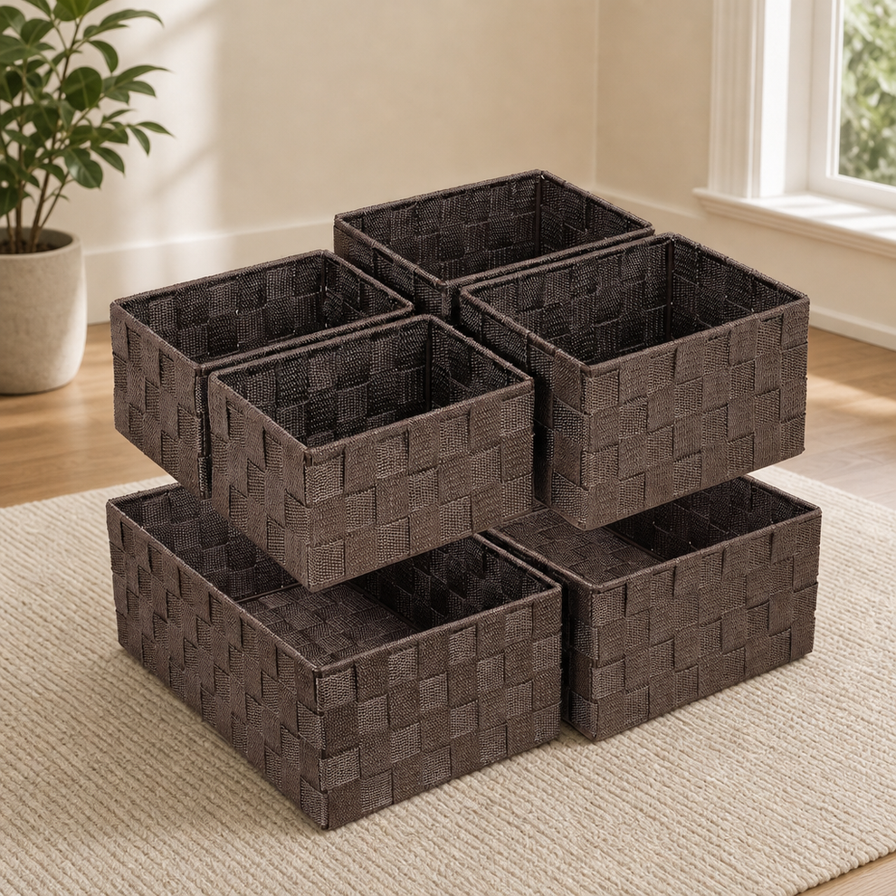 Brown woven polypropylene storage baskets stacked on a rug, angled front view in a bright room