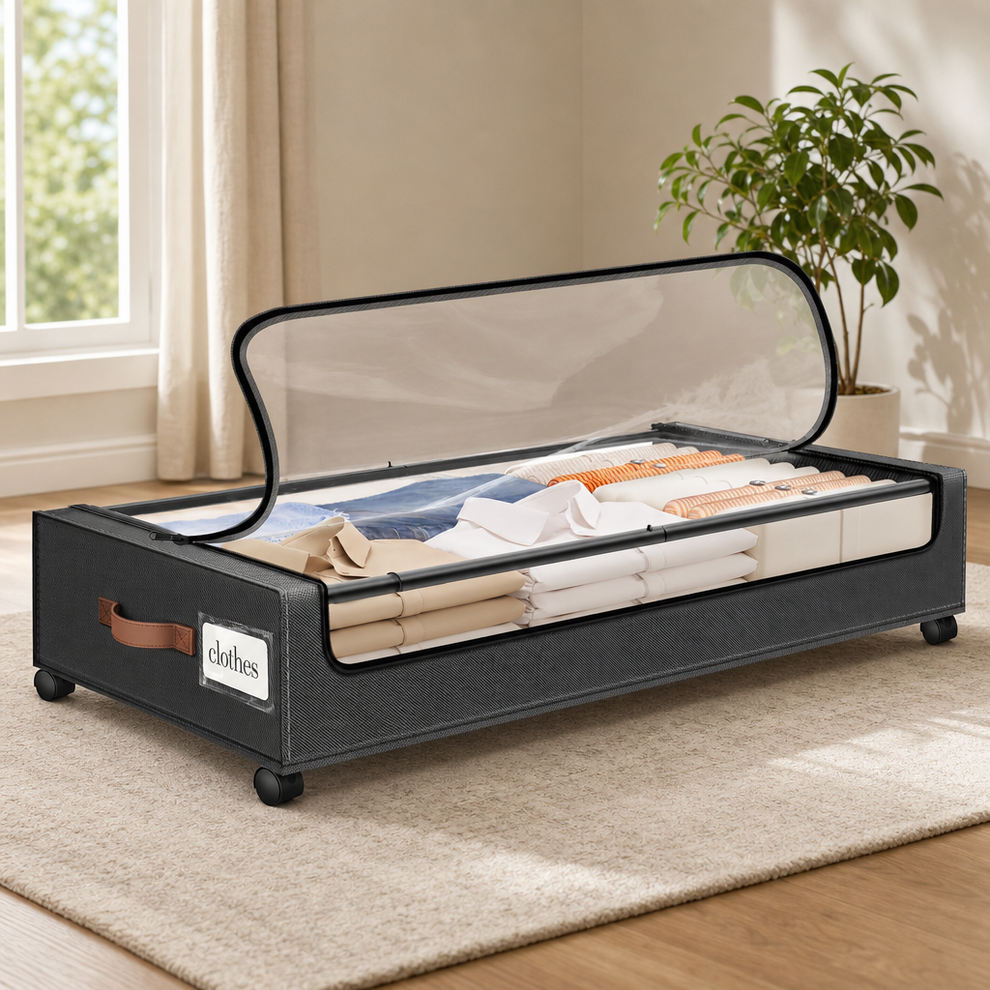 Dark grey underbed storage box with clear top window, open lid and folded clothes inside, angled side view