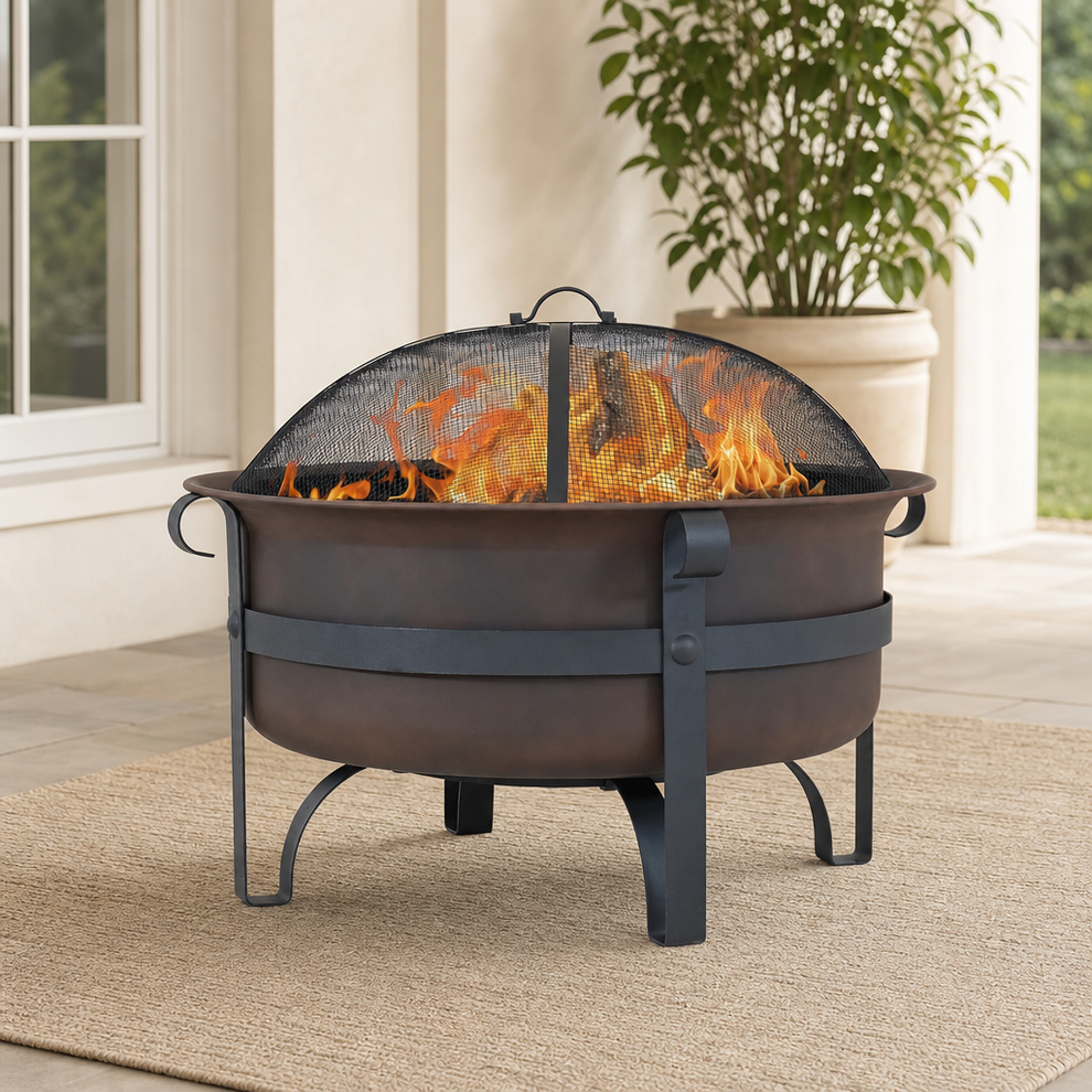 Dark bronze round wood-burning fire pit with dome mesh spark screen on a patio, front three-quarter view