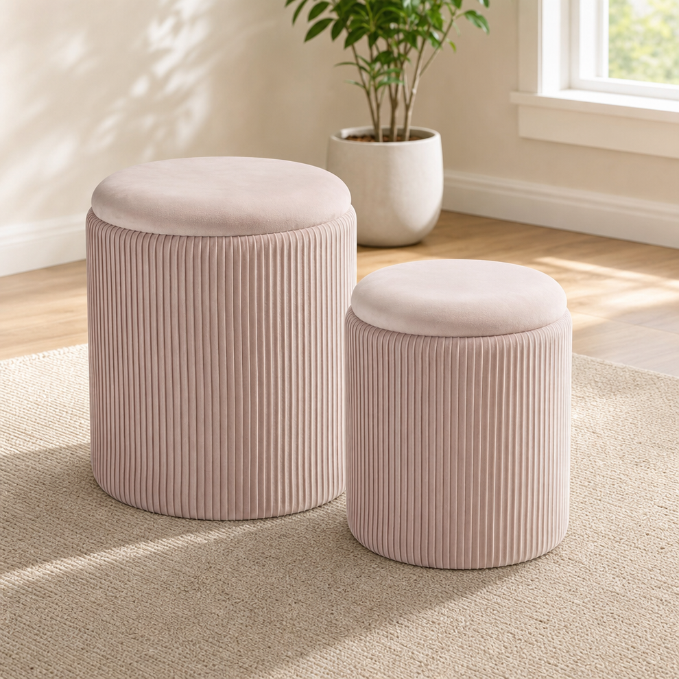 Blush pink velvet round ottoman set, angled front view with plant and rug in background.
