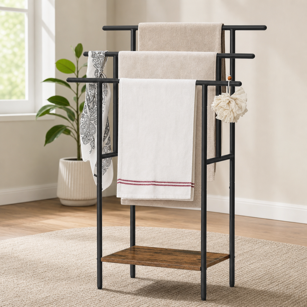 Black metal 3-tier towel rack with a wood-tone lower shelf, angled front view in a neutral living area.