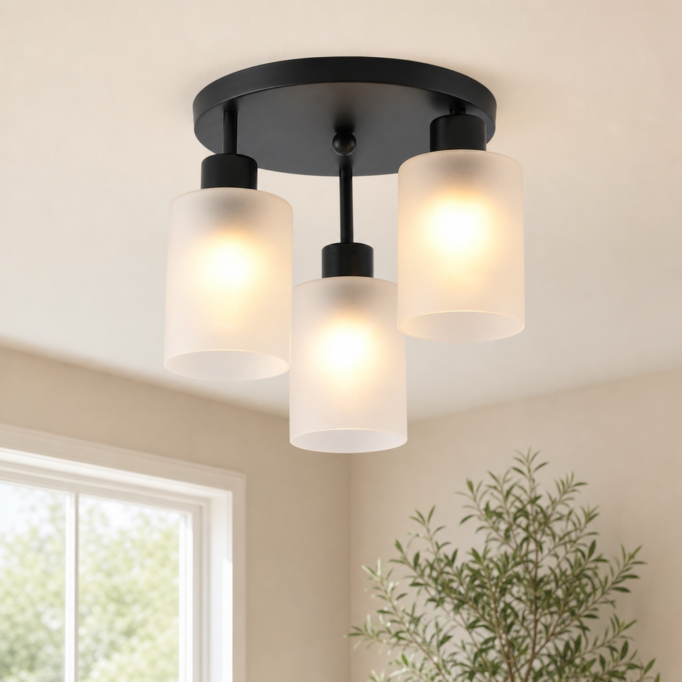 3-Light Metal Semi-Flush Ceiling Light with Frosted Glass Shades — White & Black centered in a warm neutral furnished room