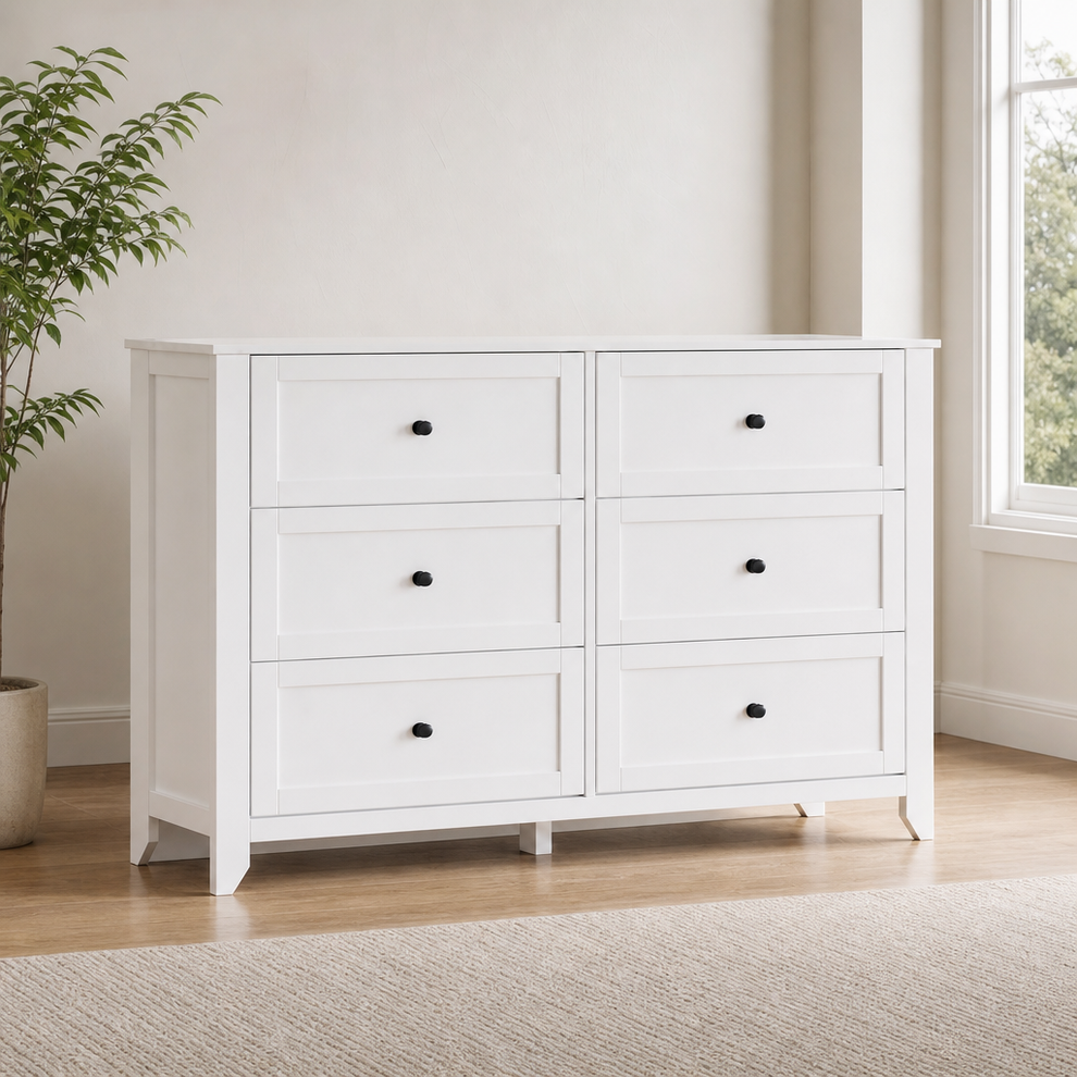 White MDF dresser with six drawers, angled front view in a bright room