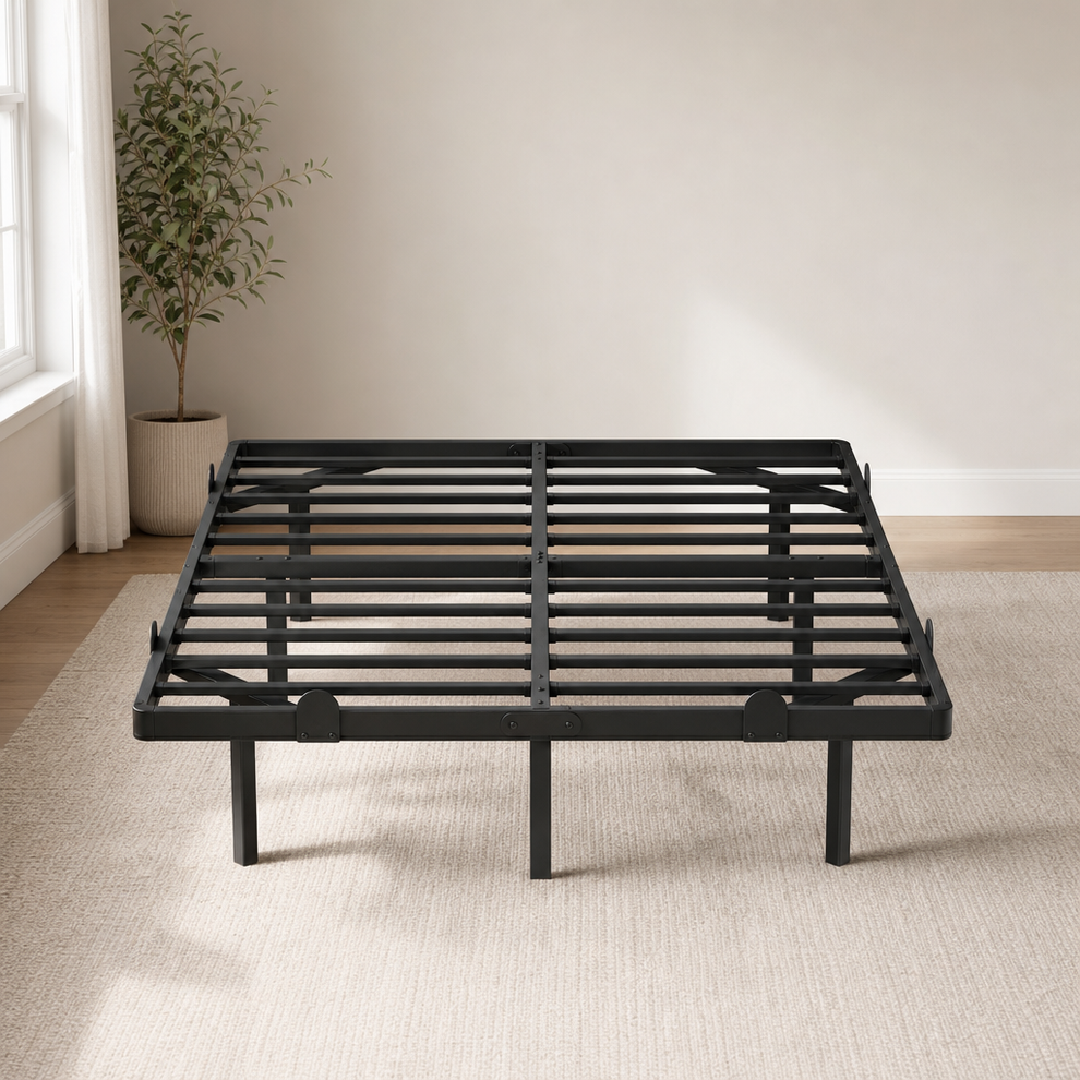 Black metal platform bed frame angled front view on a neutral rug showing slatted support and center leg
