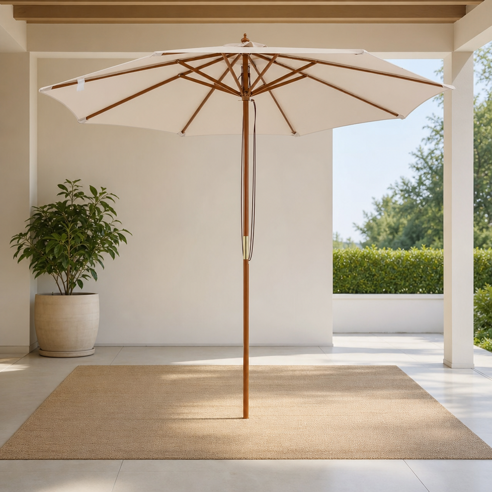 HAPPYGRILL 9 FT Patio Umbrella with Rope Pulley Lift & Vented Top centered in a warm neutral furnished room