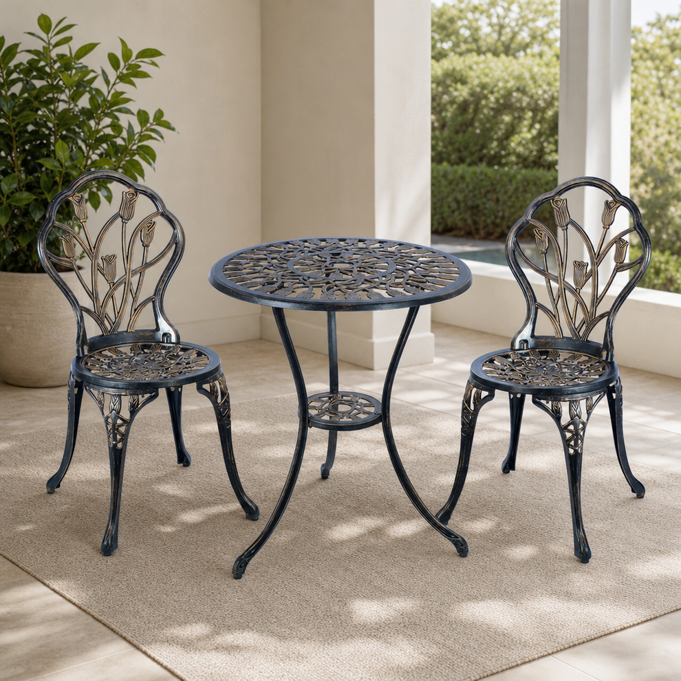 3-Piece Cast Aluminum Outdoor Bistro Set with Table and 2 Chairs centered in a warm neutral furnished room