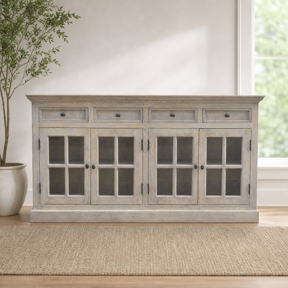 Acid-Wash Glazed Sideboard with 4 Doors and 4 Drawers centered in a warm neutral furnished room