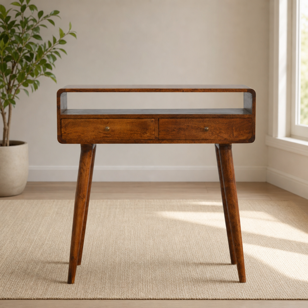 Curved Chestnut Mango Wood Console Table with Two Drawers centered in a warm neutral furnished room