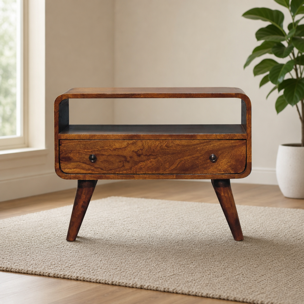 Mini Chestnut Curved Media Unit centered in a warm neutral furnished room