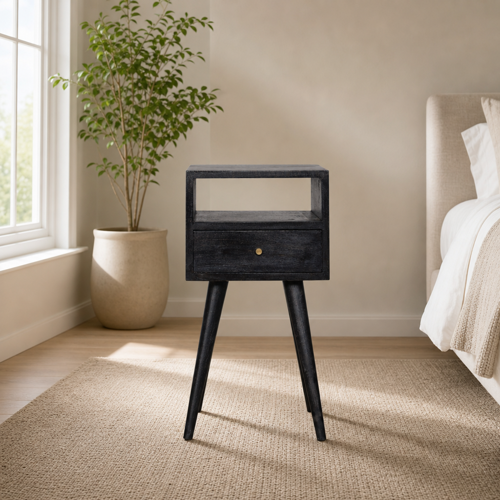 Mini Ash Black Nightstand with Drawer and Shelf centered in a warm neutral furnished room