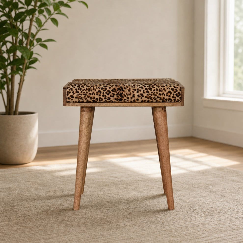 Tray-Style Upholstered Footstool with Solid Mango Wood Legs centered in a warm neutral furnished room