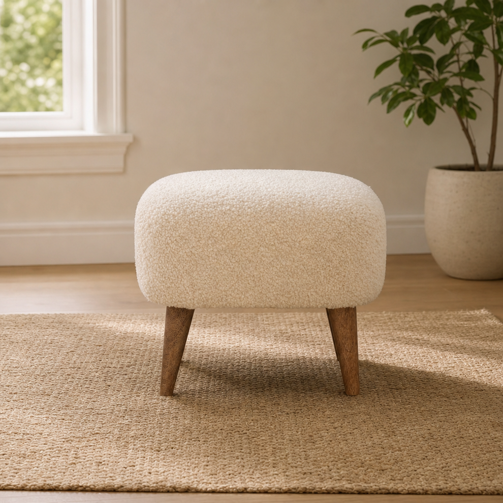 Square Cream Boucle Footstool centered in a warm neutral furnished room