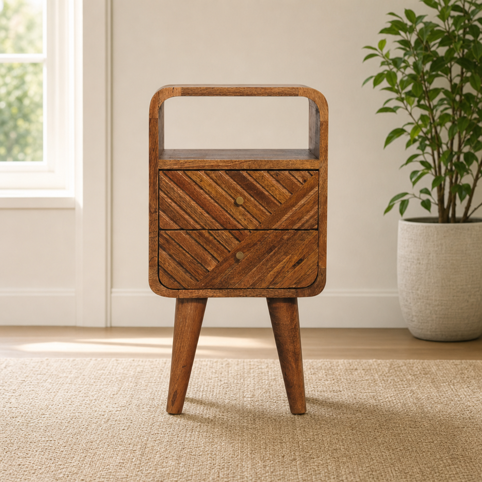 Curved Solid Mango Wood Nightstand with Open Shelf and Carved Drawers centered in a warm neutral furnished room
