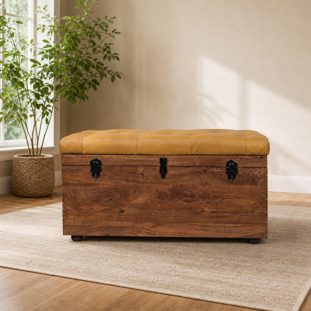 Buffalo Hide Storage Trunk with Honey Caramel Finish centered in a warm neutral furnished room