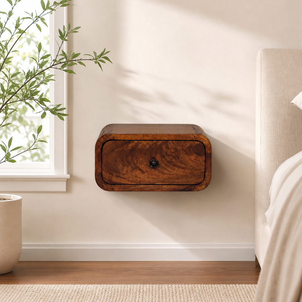 Avora Mini Wall-Mounted Chestnut 1 Drawer Nightstand centered in a warm neutral furnished room