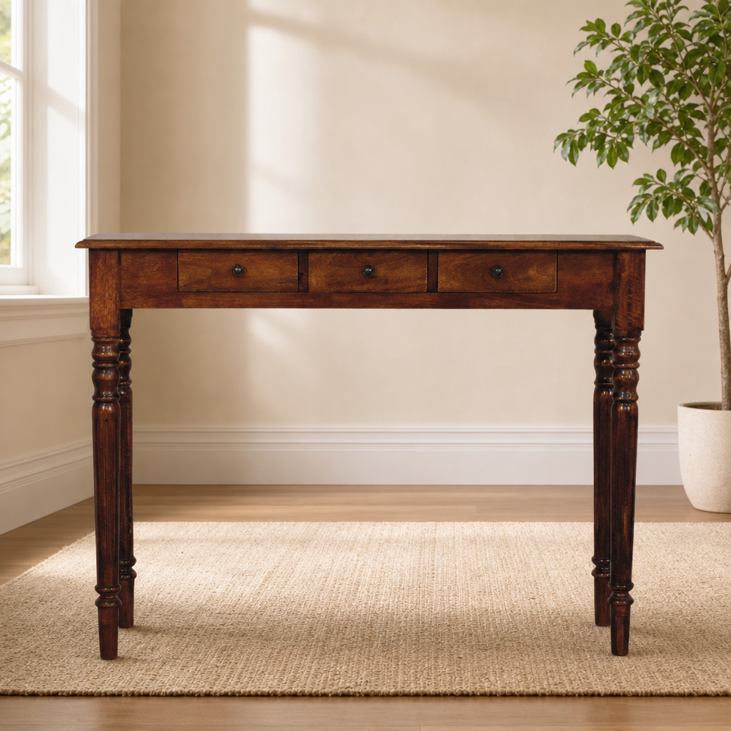 Solid Mango Wood Console Table with 3 Drawers, Turned Legs & Chestnut Finish centered in a warm neutral furnished room