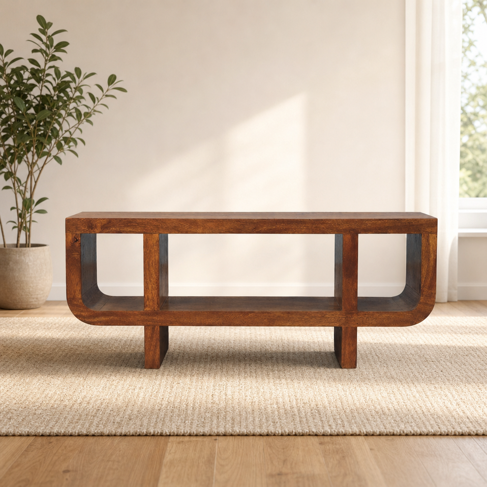 Orion Curved Chestnut Media Unit centered in a warm neutral furnished room