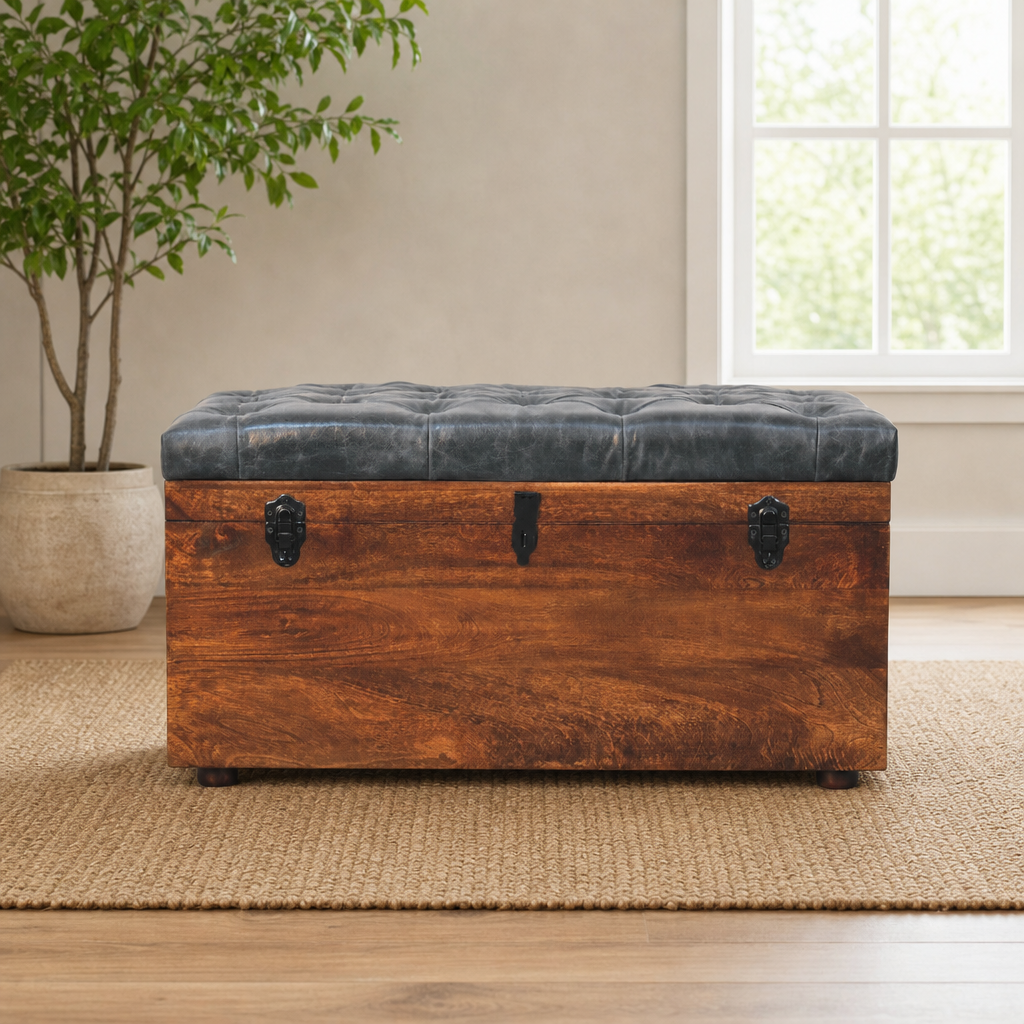 Mango Wood Storage Trunk with Buffalo Hide Leather Seat, California Walnut Finish centered in a warm neutral furnished room