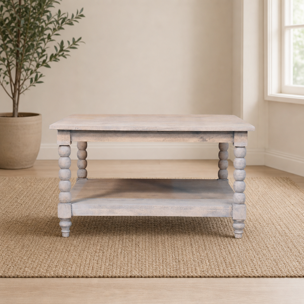 Spindle Acid Wash Coffee Table centered in a warm neutral furnished room