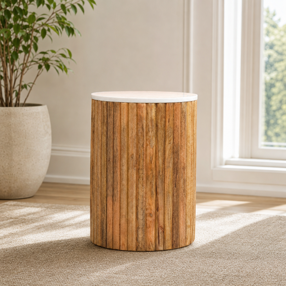 Fluted Marble Side Table centered in a warm neutral furnished room