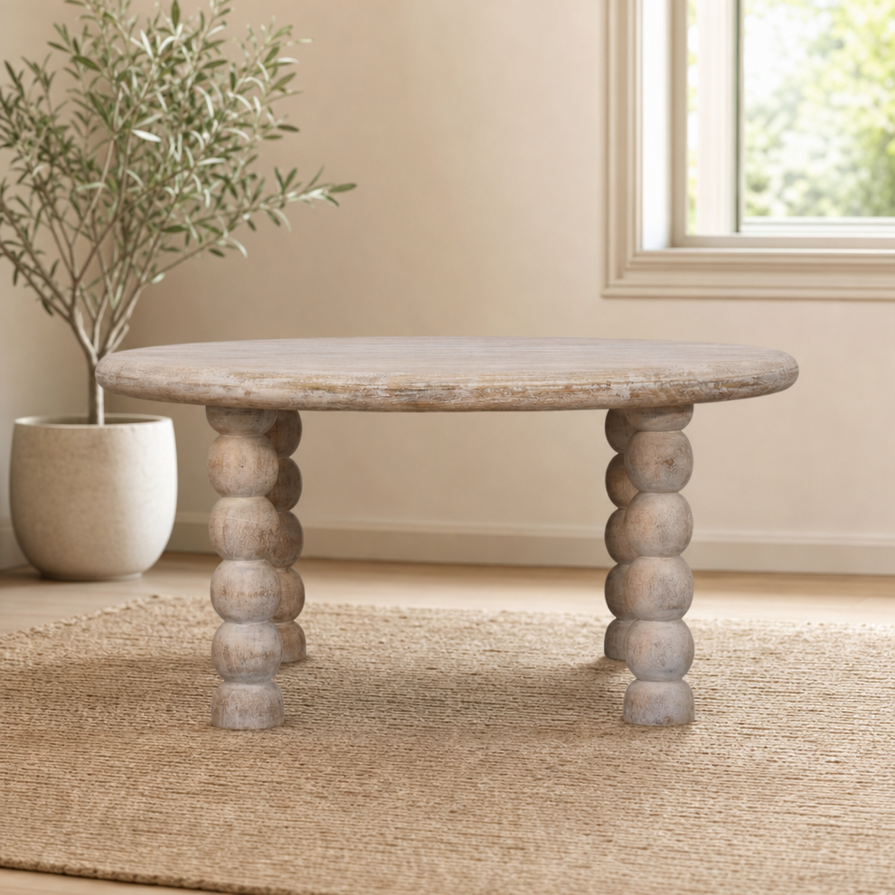 Spindle Salted Oak Coffee Table centered in a warm neutral furnished room