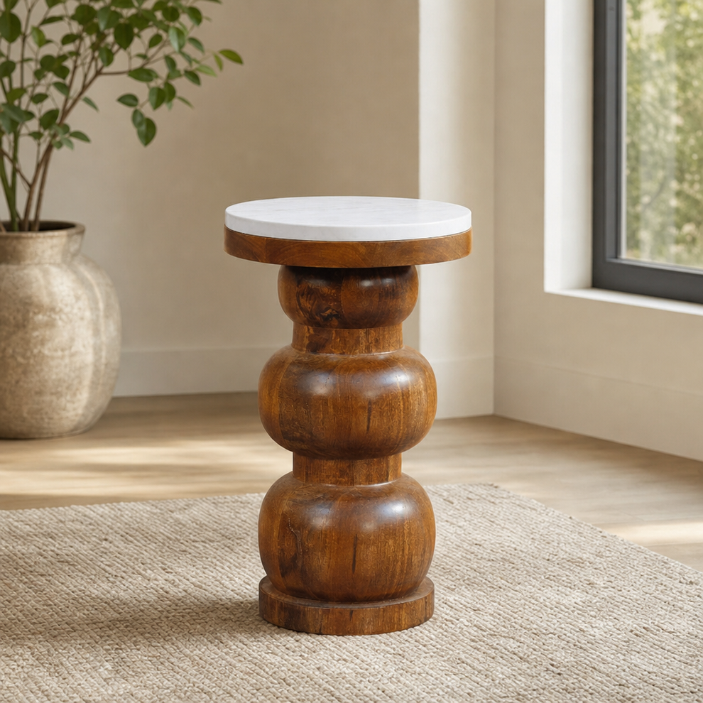 Marble Top Bulla Side Table centered in a warm neutral furnished room