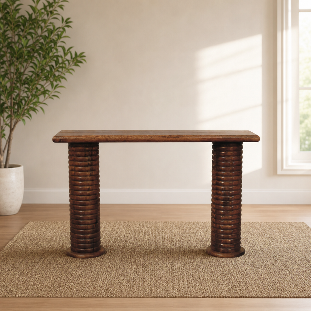 Sculpted Leg Console centered in a warm neutral furnished room