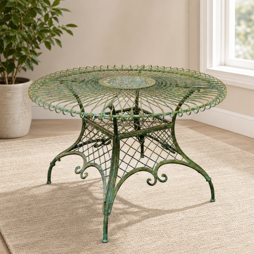 48" Victorian-Style Large Round Iron Table in Antique Green centered in a warm neutral furnished room