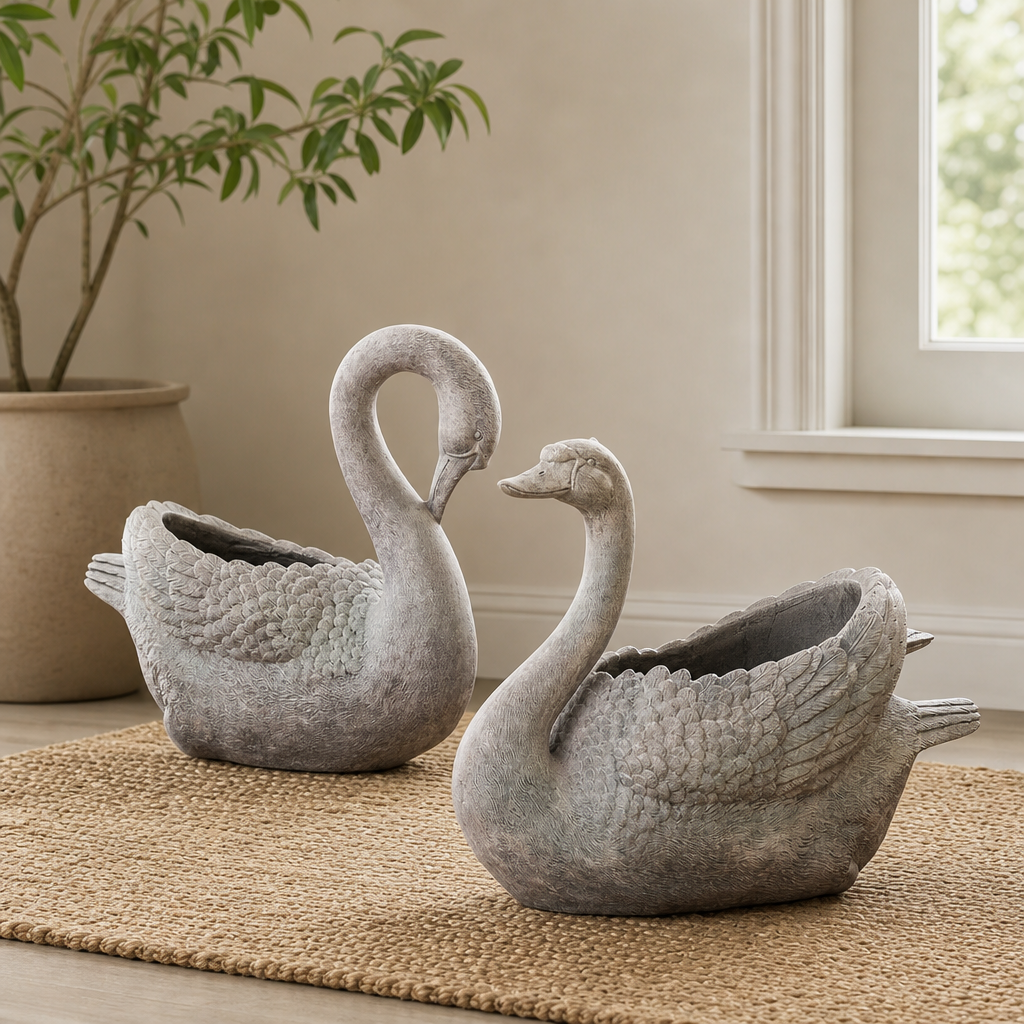 Set of 2 Magnesium Swan Planters "Derek & Odette" centered in a warm neutral furnished room