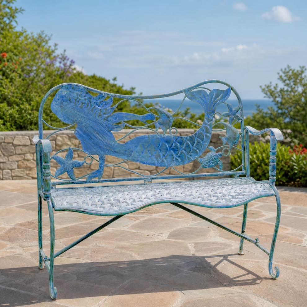 43" Metal Coastal Mermaid Garden Bench with Curved Seat "Sirena" centered in a warm neutral furnished room