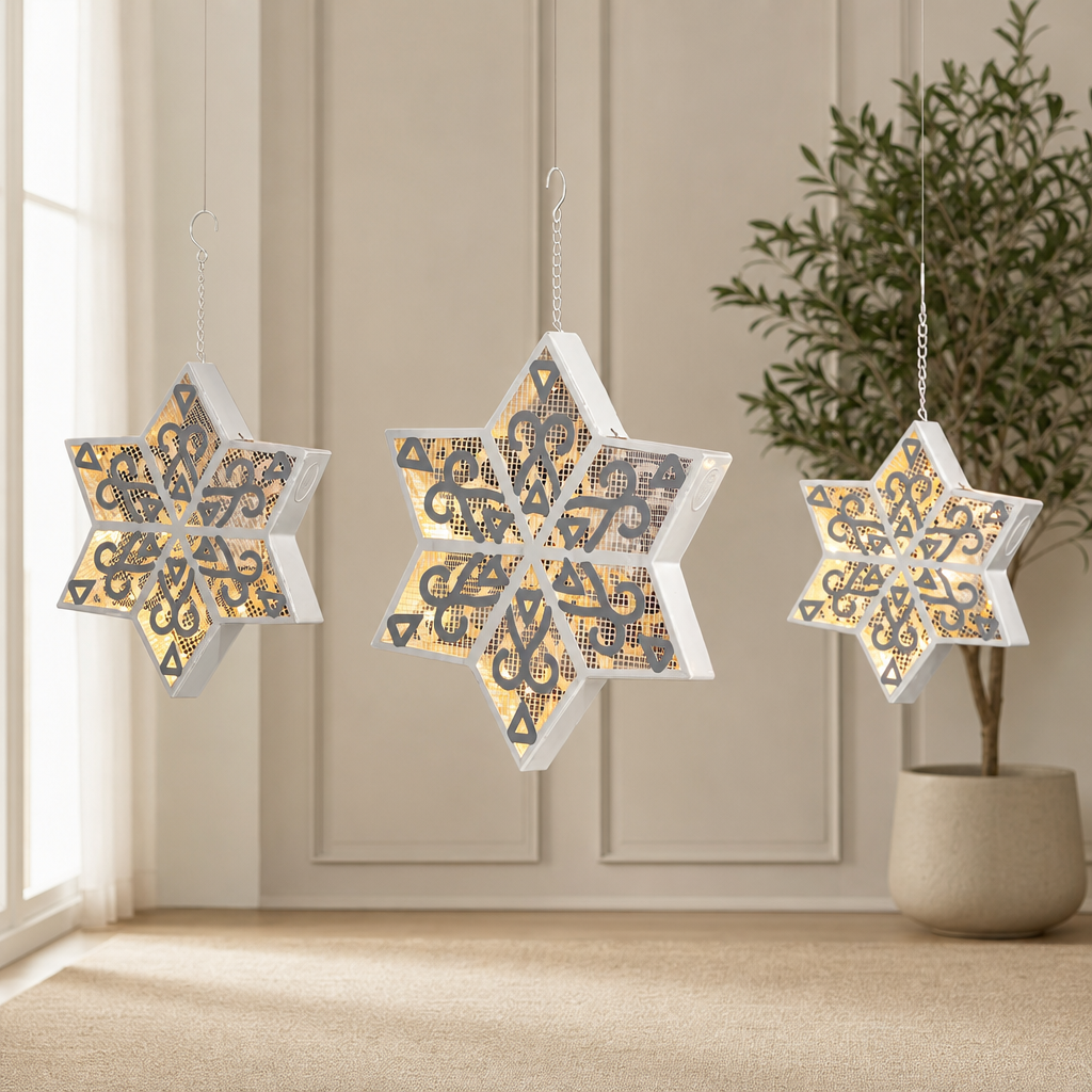 Set of Three Hanging Light-Up Six-Point Star Snowflakes centered in a warm neutral furnished room