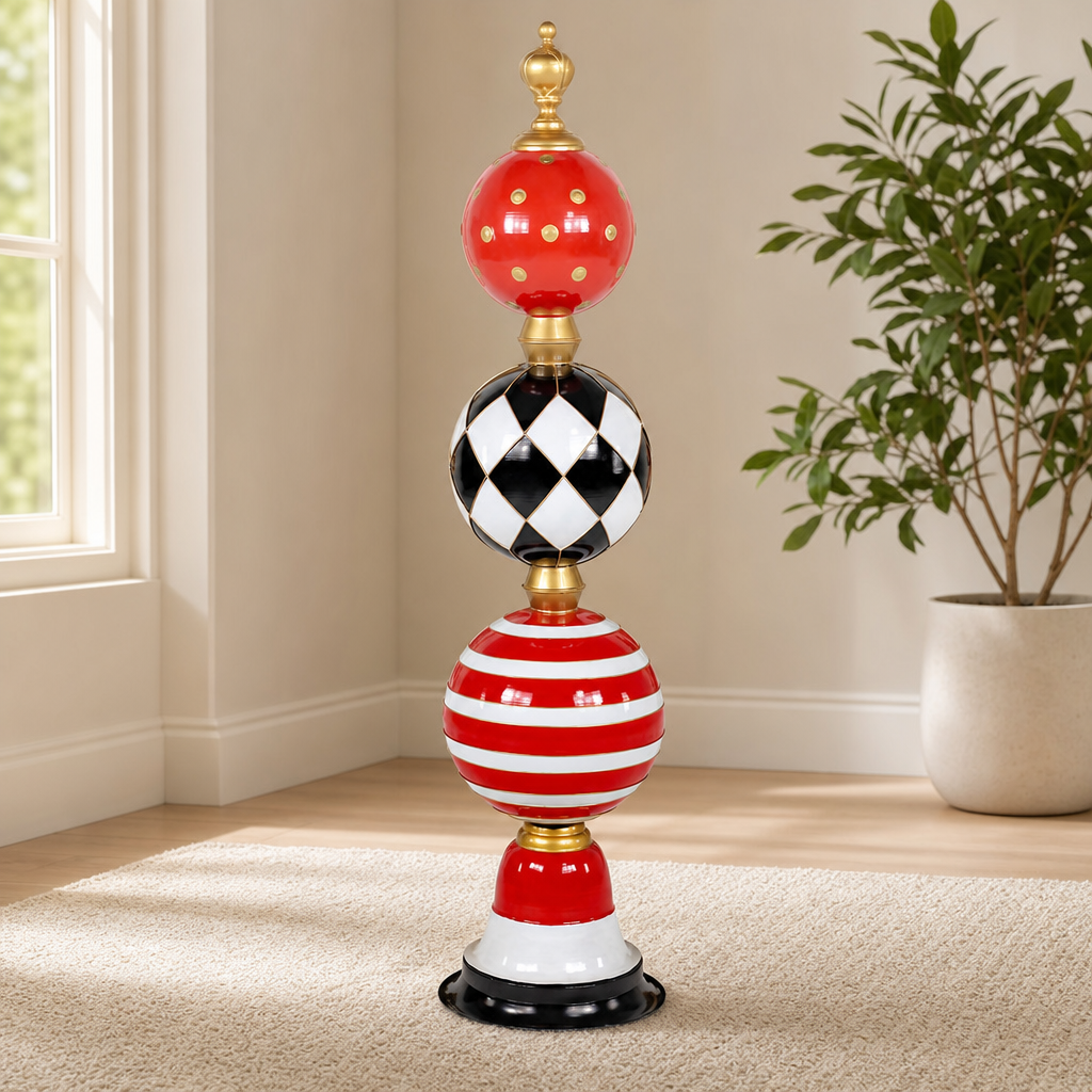 5.6 Ft. Tall Iron Christmas Ornament Decorative Display Tower in Red, Black & Whit centered in a warm neutral furnished room