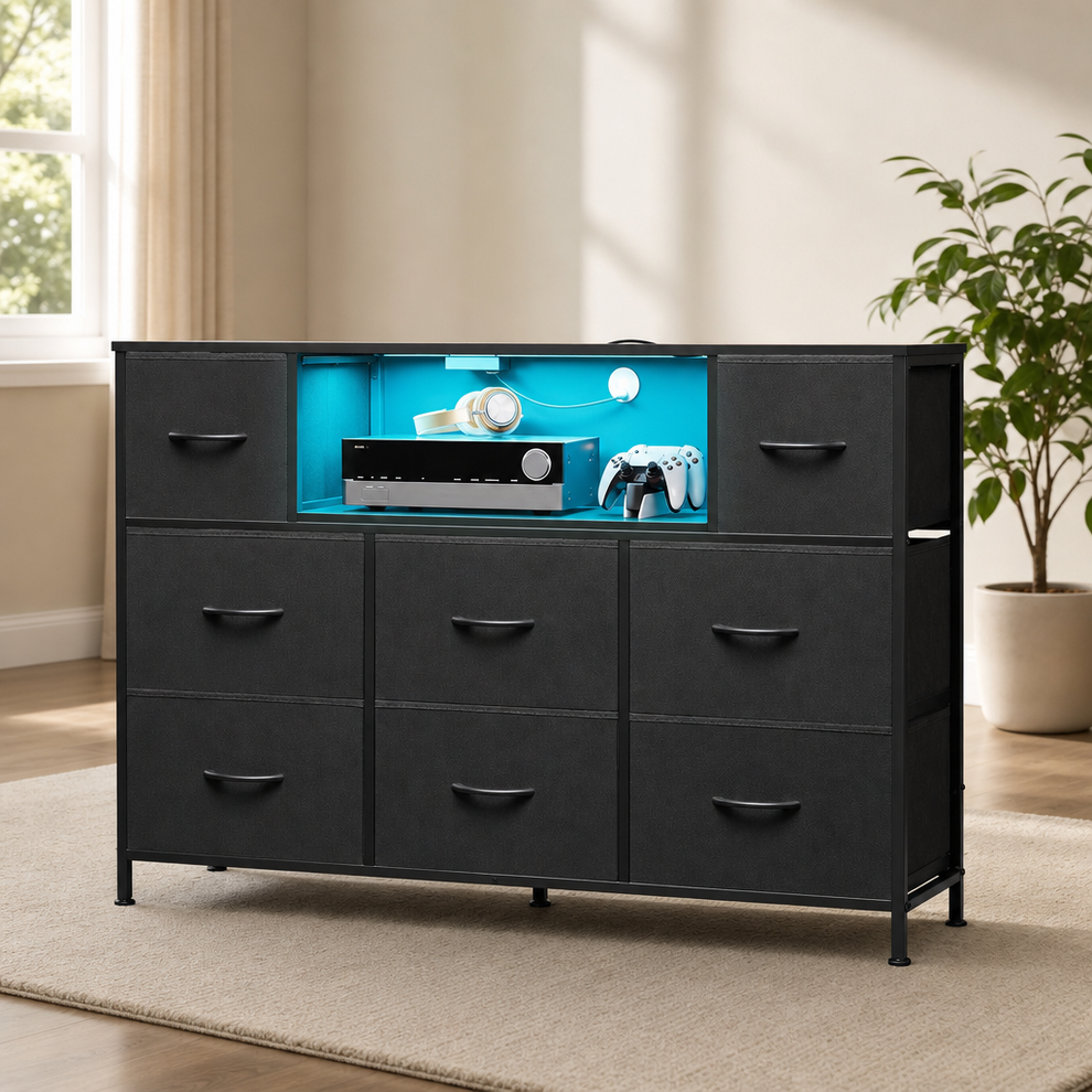 Black 8-drawer dresser front view with teal LED-lit open shelf in a bright living room