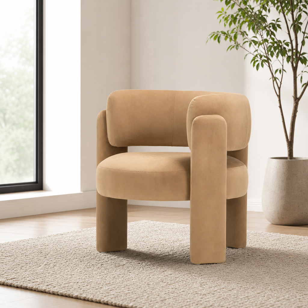 Tan velvet barrel accent chair angled front view in a bright room