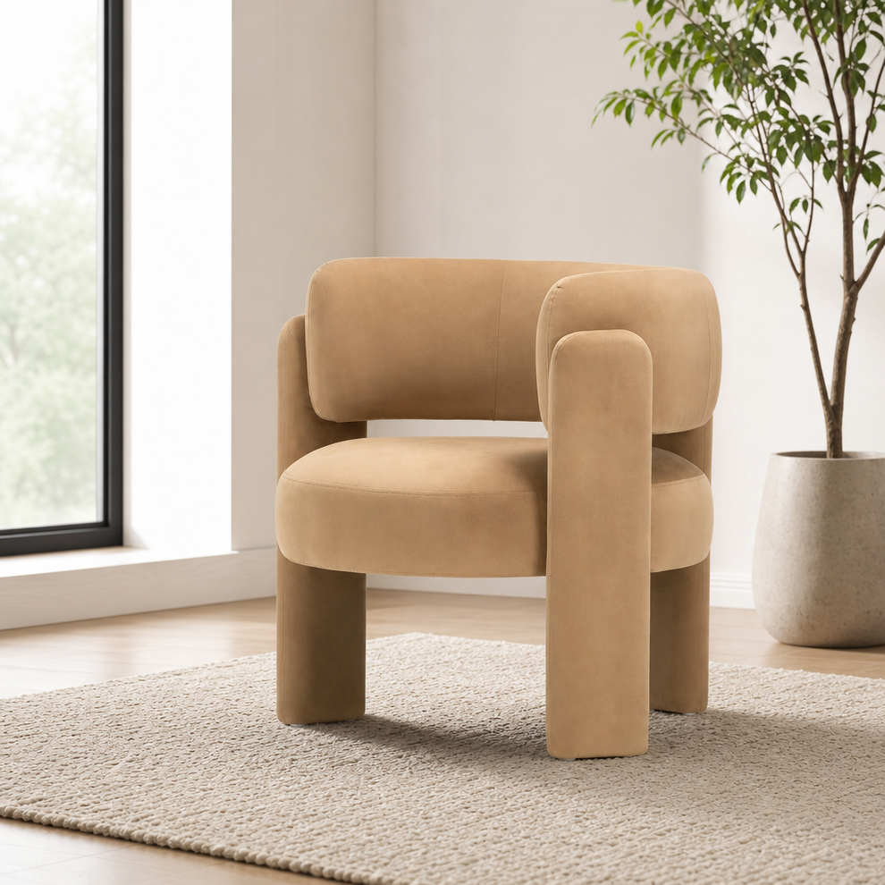 Tan velvet barrel accent chair angled front view in a bright room
