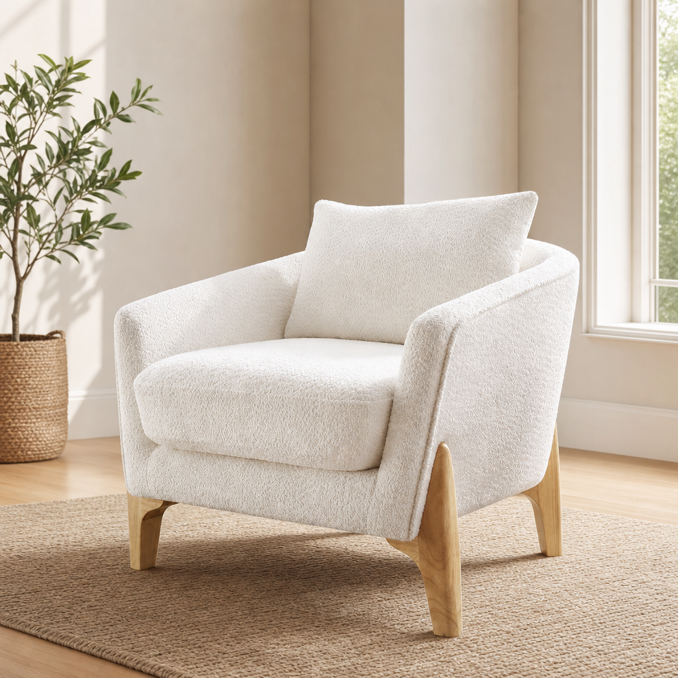 White fleece oversized accent chair angled front view with visible solid wood legs in a living room setting