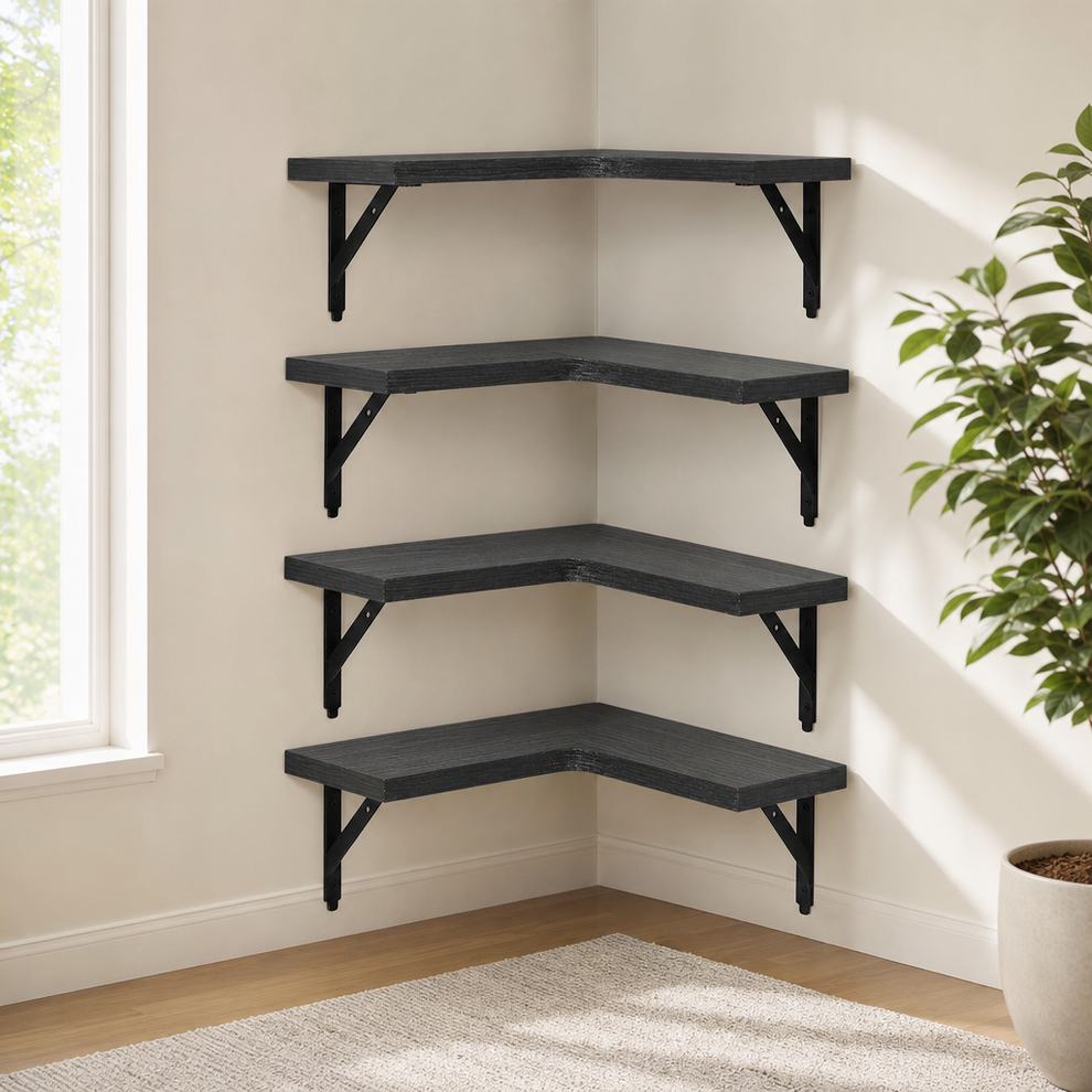 Dark grey L-shaped corner shelves mounted in a corner with black metal brackets, four shelves stacked.