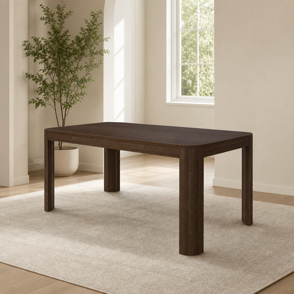 Walnut finish solid wood rectangular dining table, angled front-left view in a sunlit room