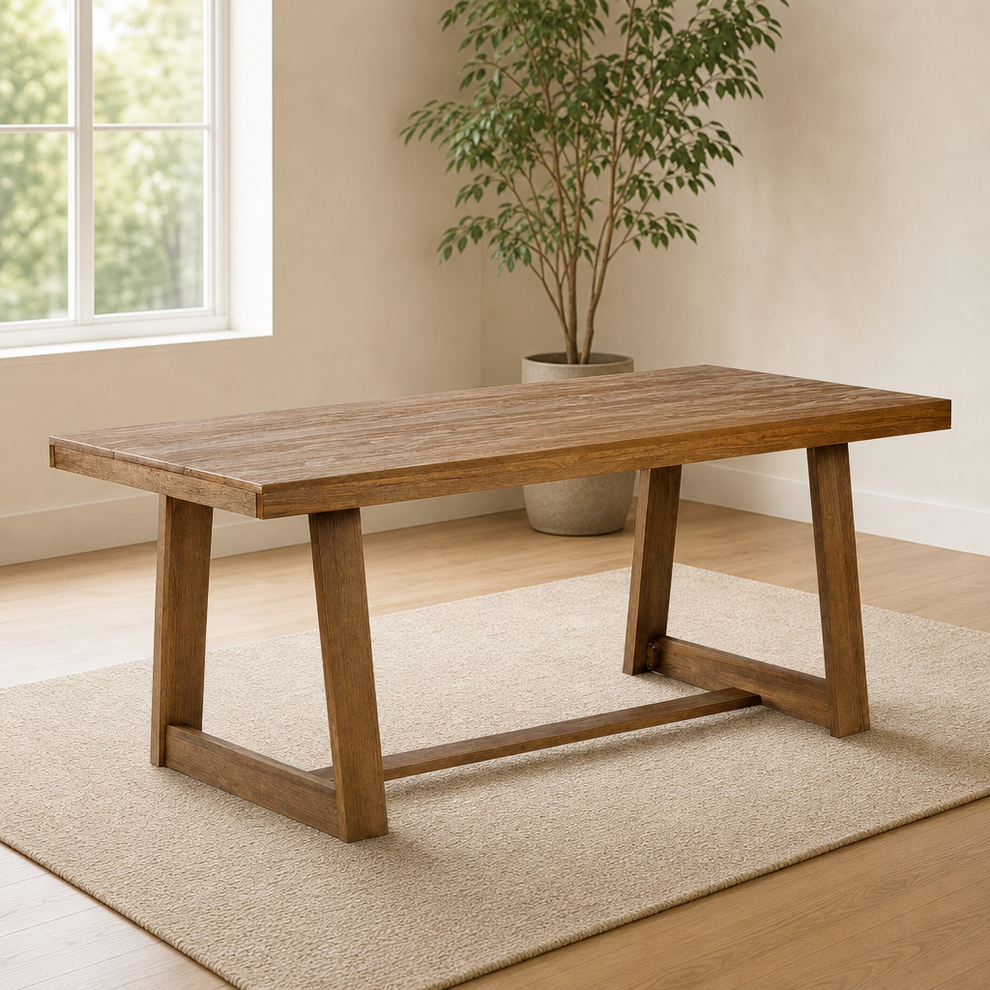 Solid pine farmhouse dining table in warm brown wirebrush finish, angled front-left view on a rug