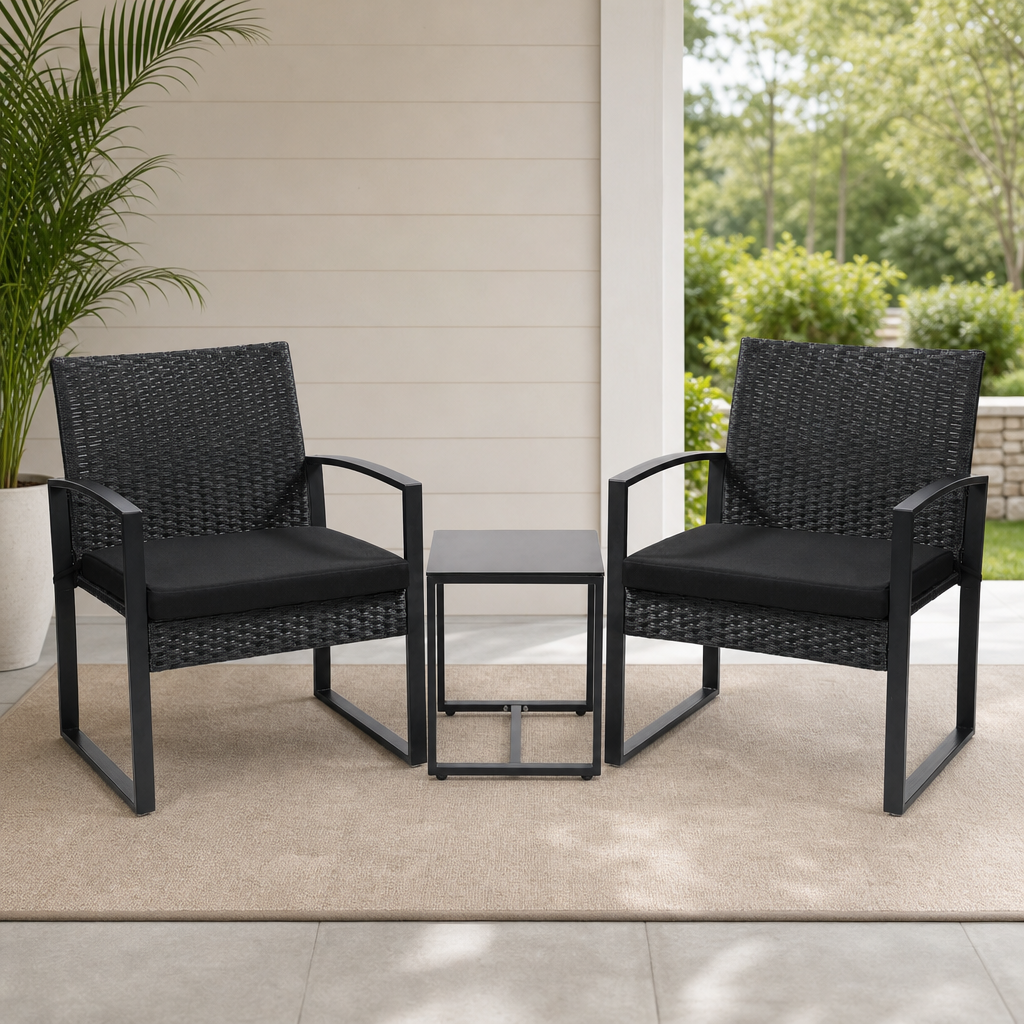 Black rattan two-seat bistro set with square tempered glass table on a porch rug, front view