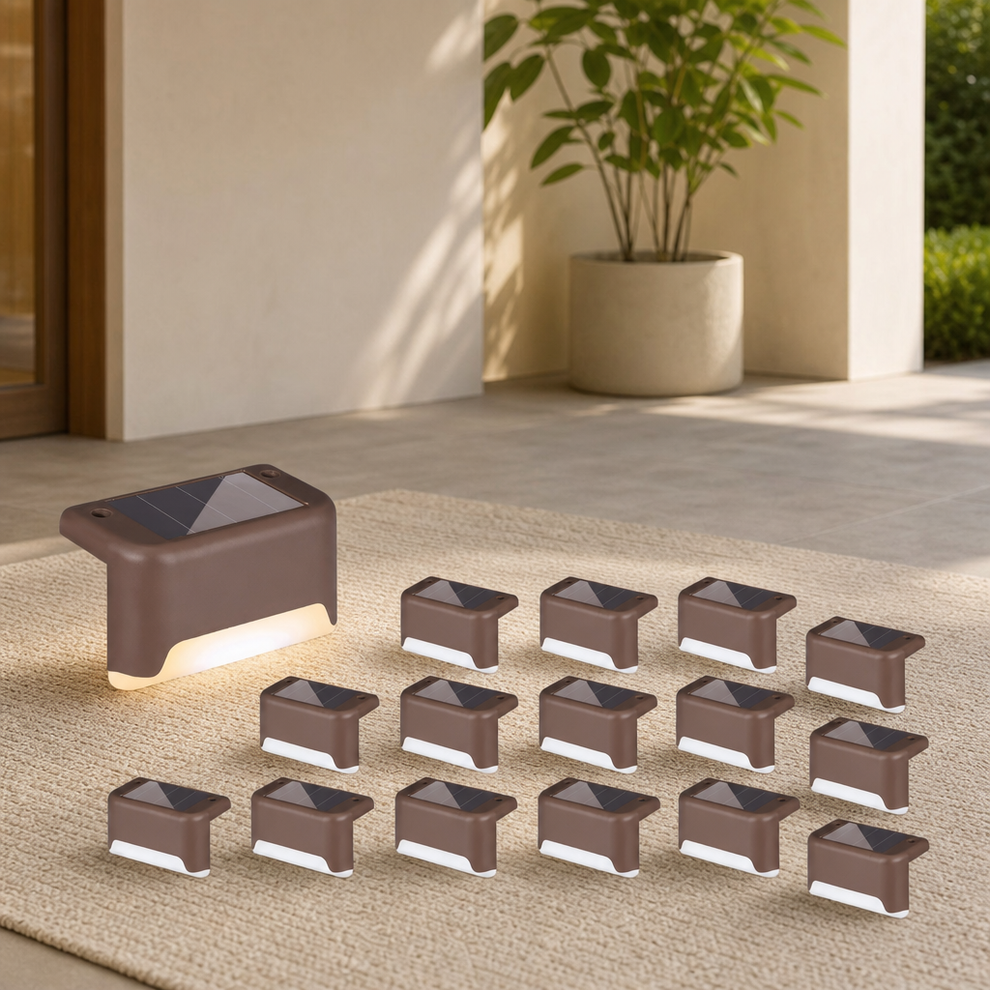 Brown solar step lights arranged on a mat with one enlarged unit lit and multiple units displayed