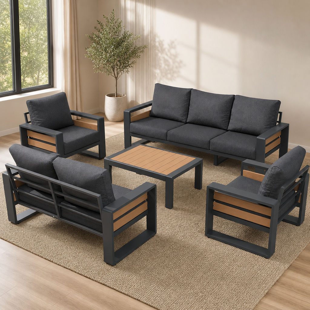 Dark grey aluminum-frame sofa and chairs with wood-texture slats and dark grey cushions, angled top-front view in a room